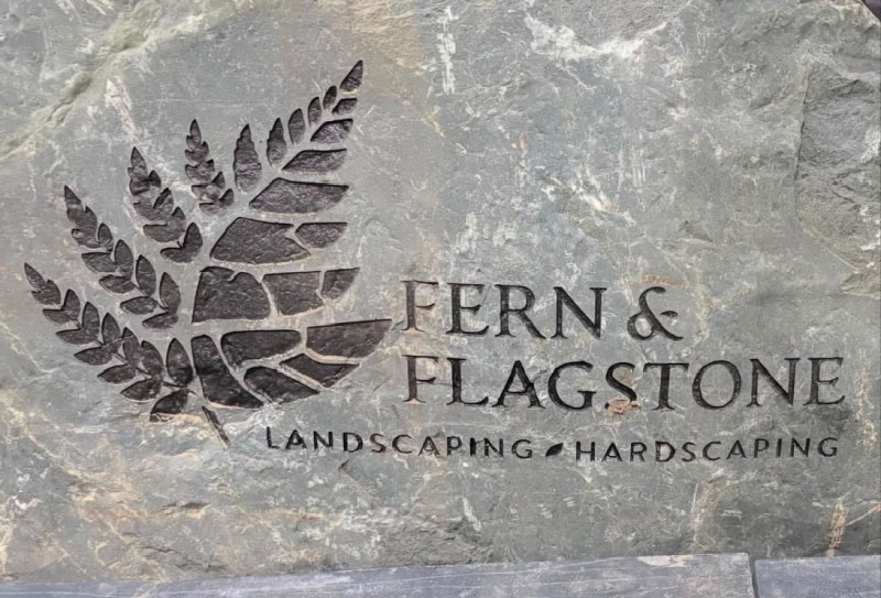 landscaping logo engraved into rock