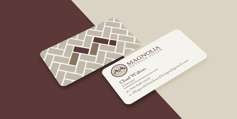 picture of front and back of business cards with magnolias logo and brand colors